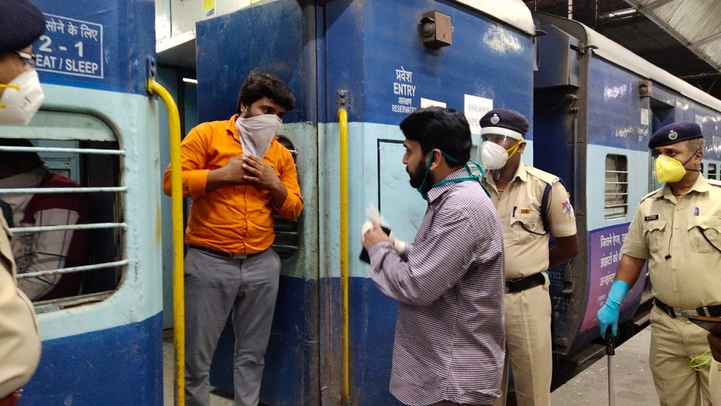 Vishwajeet Kadam meeting a worker during at Pune railway station.