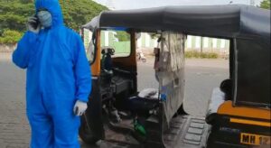 Pune Auto driver in PPE suit